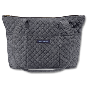 Small Tote front view featuring quilted solid, in deep midnight blue, with top zip closure, and 10 total pockets.