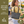 Side-view of woman carrying Small Tote, highlighting quilted solid fabric, structured silhouette, and lightweight microfiber construction.
