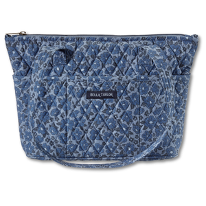 Small Tote front view featuring quilted floral print, in dusty blue, cobalt, & navy, with top zip closure, and 10 total pockets.