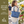 Side-view of woman carrying Small Tote, highlighting quilted floral fabric, structured silhouette, and lightweight 100% cotton construction.