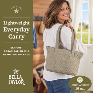 Side-view of woman carrying Small Tote, highlighting quilted solid fabric, structured silhouette, and lightweight microfiber construction.