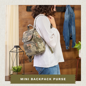 Front-view of woman carrying Mini Backpack highlighting quilted patchwork fabric, adjustable backpack straps, and lightweight 100% cotton construction.