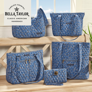 Navy Floral collection lifestyle image featuring the full line displayed, including tote, crossbody, and cosmetic pouch.