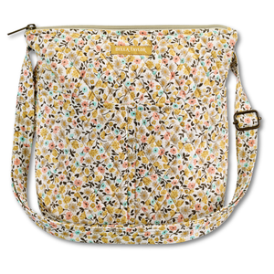 Hipster front view featuring quilted floral fabric in harvest amber, dusty rose, warm tan, & robin's egg blue, with top zip closure, and 6 total pockets.