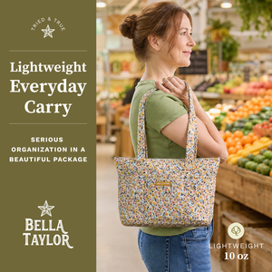 Side-view of woman carrying Small Tote, highlighting quilted floral fabric, structured silhouette, and lightweight 100% cotton construction.