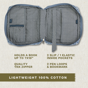 Open top-down view revealing interior with three pockets, two pen loops, YKK zipper, bookmark ribbon, and room for a book up to 7" x 10".