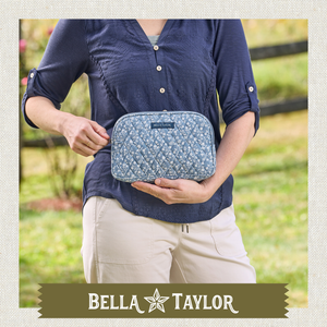 Top-down view of woman holding open cosmetic pouch, showing what fits inside.