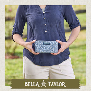 Front-view of woman holding Slim Card Wallet made with lightweight 100% cotton. 