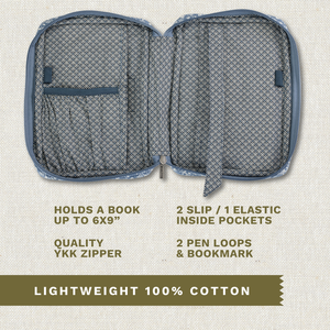 Open top-down view revealing interior with three pockets, two pen loops, YKK zipper, bookmark ribbon, and room for a book up to 6" x 9".