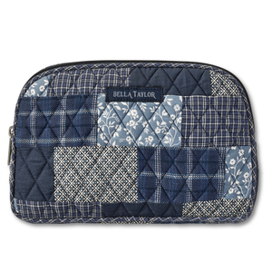 Cosmetic Pouch front view featuring quilted patchwork fabric in warm cream, indigo, & navy.