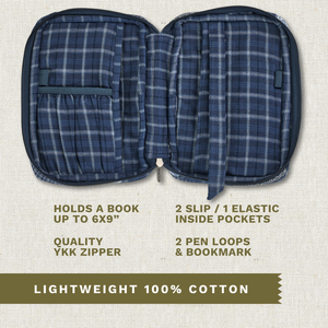 Open top-down view revealing interior with three pockets, two pen loops, YKK zipper, bookmark ribbon, and room for a book up to 6" x 9".