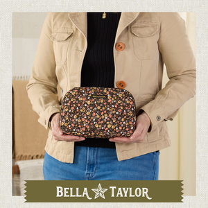 Top-down view of woman holding open cosmetic pouch, showing what fits inside.
