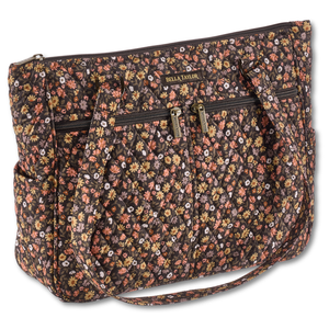 Everyday Tote front view featuring quilted floral print in espresso brown, golden tan, soft ivory, and dusty mauve, with top zip closure, and 10 total pockets.