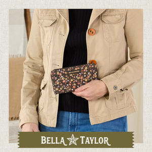 Front-view of woman holding Slim Card Wallet made with lightweight 100% cotton.