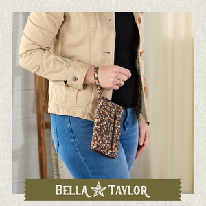 Front-view of woman holding Wrist Strap Wallet made with lightweight 100% cotton construction