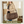 Side-view of woman carrying Navy Floral Duffle highlighting 55