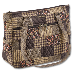 Everyday Tote front view featuring quilted patchwork print in espresso brown, golden tan, soft ivory, and dusty mauve, with top zip closure, and 10 total pockets.