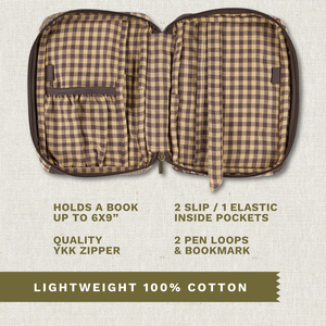 Open top-down view revealing interior with three pockets, two pen loops, YKK zipper, bookmark ribbon, and room for a book up to 6" x 9".