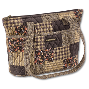 Small Tote front view featuring quilted patchwork print, in espresso brown, golden tan, soft ivory, and dusty mauve with top zip closure, and 10 total pockets.
