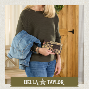 Front-view of woman holding Wrist Strap Wallet made with lightweight 100% cotton construction
