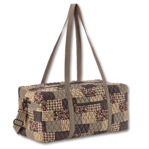 Duffle front view featuring quilted patchwork fabric in espresso brown, golden tan, soft ivory, and dusty mauve with 5 total pockets.