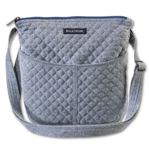 Hipster front view featuring solid soft blue fabric, with top zip closure, and 6 total pockets.