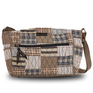 Claire front view featuring quilted patchwork fabric in warm grey, antiqued tan, & vintage white, with top zip closure, and 8 total pockets.