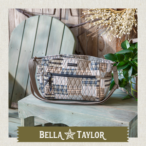 Front-view of woman carrying Claire highlighting quilted patchwork fabric, structured silhouette, and lightweight 100% cotton construction.