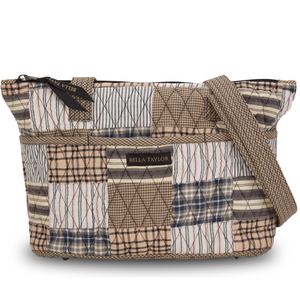 Small Tote front view featuring quilted patchwork print, in tan, white, grey with top zip closure, and 10 total pockets.