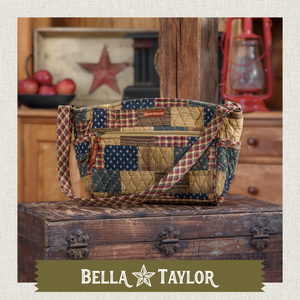Front-view of woman carrying Claire highlighting quilted patchwork fabric, structured silhouette, and lightweight 100% cotton construction.